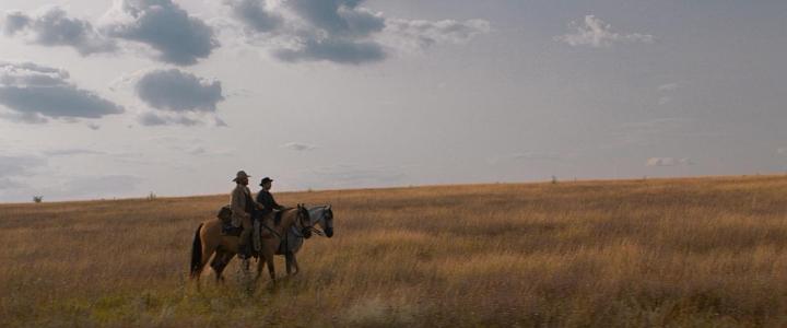 Jake Gyllenhaal and Riz Ahmed in The Sisters Brothers (2018)