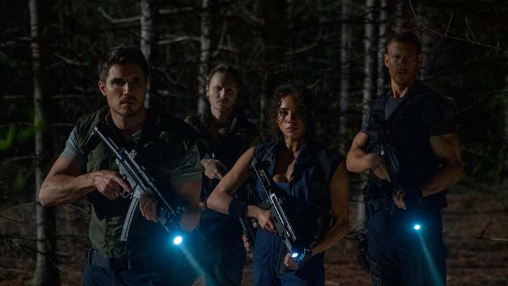 Chad Rook, Robbie Amell, Tom Hopper, and Hannah John-Kamen in Resident Evil: Welcome to Raccoon City (2021)