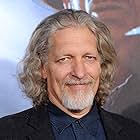 Clancy Brown به عنوان Harbinger