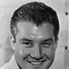 George Reeves به عنوان Stuart Tarleton - Scarlett's Beau