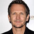 Sebastian Roché به عنوان Brill