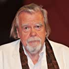 Michael Lonsdale به عنوان Theon