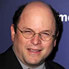 Jason Alexander به عنوان Sy Borgman