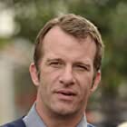 Thomas Jane به عنوان Chuck Hill