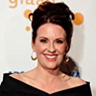 Megan Mullally به عنوان Angie Evans