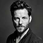 Jamie Bamber به عنوان Col. Alexander Coltrane