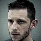 Jamie Bell به عنوان Bernie Taupin