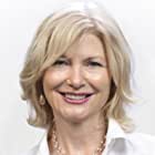 Beth Broderick به عنوان Angela Corrigan