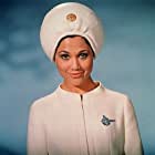 Edwina Carroll به عنوان Aries-1B Stewardess