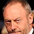 Liam Cunningham به عنوان Captain Eliot