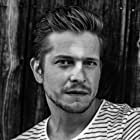 Matt Czuchry به عنوان Conrad Hawkins