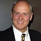 Alan Dale به عنوان Dr. Sanders