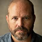 David Denman به عنوان Frank Sheehan