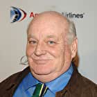 Brian Doyle-Murray به عنوان Janitor