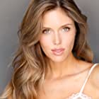 Kayla Ewell به عنوان Nora Truman