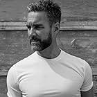 Jay Harrington به عنوان Sergeant David 'Deacon' Kay