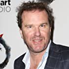 Douglas Hodge به عنوان Robert Adelman