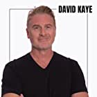 David Kaye به عنوان Newsreel Announcer