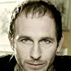 Paul Kaye به عنوان Arthur Savage