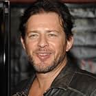 Costas Mandylor به عنوان Hoffman