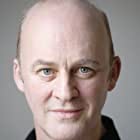 Tim McInnerny به عنوان Leonard Montefiore