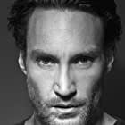 Callan Mulvey به عنوان John Reeves