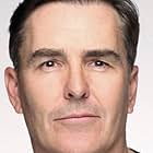 Nolan North به عنوان Conrad Roth