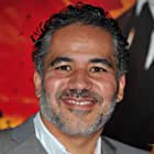 John Ortiz به عنوان Carlos Cavell