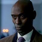 Lance Reddick به عنوان Charon