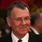 Tom Wilkinson به عنوان Carmine Falcone