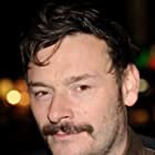 Julian Barratt به عنوان Dr. Elphick