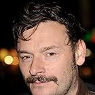 Julian Barratt به عنوان George