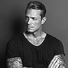 Joel Kinnaman به عنوان Brian Godlock