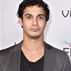 Elyes Gabel به عنوان Sean Tilson