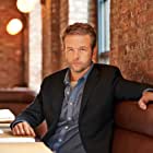 Dallas Roberts به عنوان David Wayne