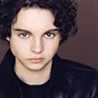 Max Burkholder به عنوان Charlie Sandin