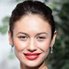 Olga Kurylenko به عنوان Alexis Faraday