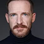 Marc Evan Jackson به عنوان Agent Trout