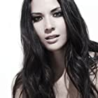 Olivia Munn به عنوان Monica Reed