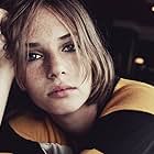 Maya Hawke به عنوان Grace