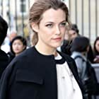 Riley Keough به عنوان Mellie Logan