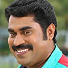 Suraj Venjaramoodu به عنوان Kuruvila Joseph