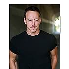 Chris Coy به عنوان Jasper Baker