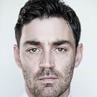 Matthew McNulty به عنوان Arj