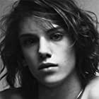 Jamie Campbell Bower به عنوان Caius