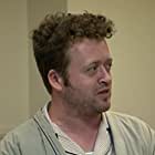 Neil Casey به عنوان Devin