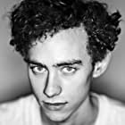 Olly Alexander به عنوان Tom Keats