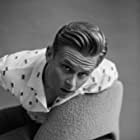 Billy Magnussen به عنوان Logan Ash