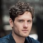 Kyle Soller به عنوان Syril Karn