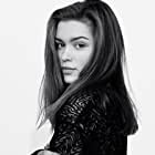 Sophie Cookson به عنوان Nora Brightman